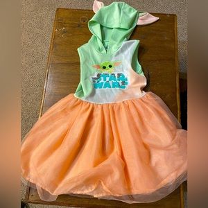 Baby yoda dress. Peach color skirt with green hood with ears.